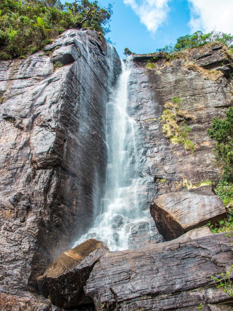 A waterfall pouring over a rocky terrain