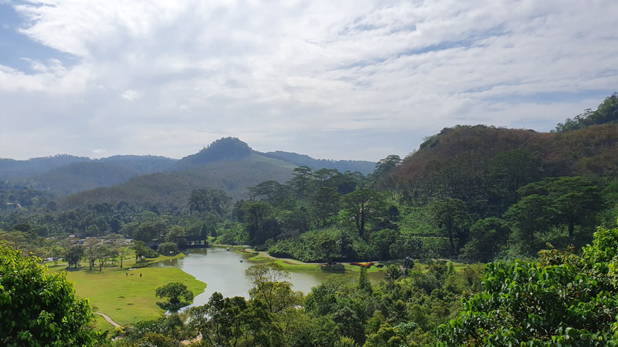 A lake flowing through the verdant mountainous surroundings of the beautiful Seethawaka Botanical Garden in Sri Lanka!