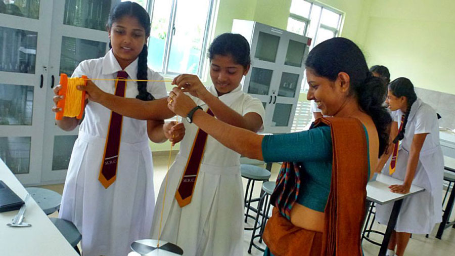 Students Experimenting with Lab Equipment, Benefiting from Free Education in Sri Lanka