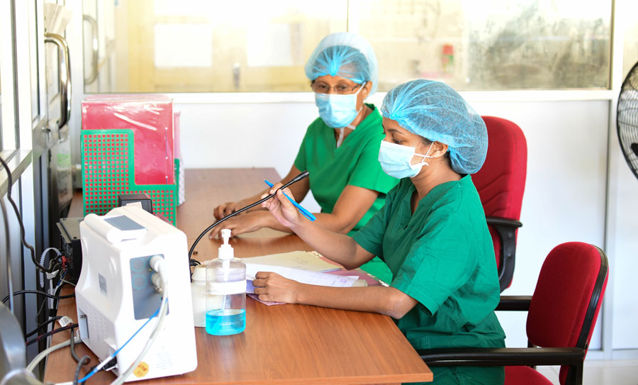 The Health Care Staff wearing green costumes and surgical caps, playing an Important Part in the Healthcare System in Sri Lanka