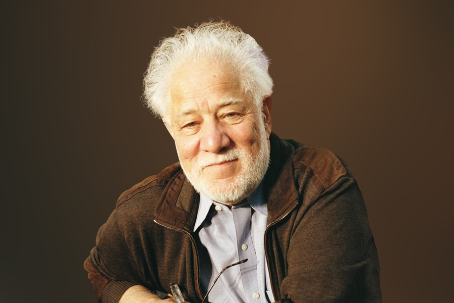 Michael Ondaatje, the Award-Winning Wonderful Author with his spectacles and the pen in hand