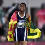 Susanthika Jayasinghe, the Great Sri Lankan Athlete with the Sri Lankan flag after a running event