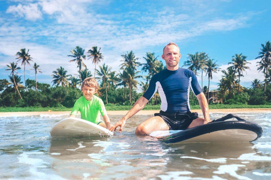 Father and Son on Surfboards, Trying Water Sports in Sri Lanka