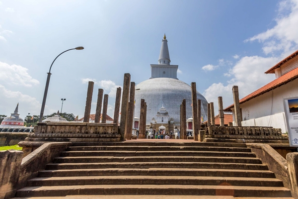 The stairway and the White large stupa of Ruwanweli Maha Seya, an Important Religious Attraction in the Ancient City of Anuradhapura.