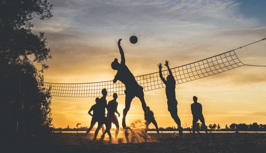 A group playing beach volleyball, signifying the Wonderful Sports Story of Sri Lanka, from its History to the Future!