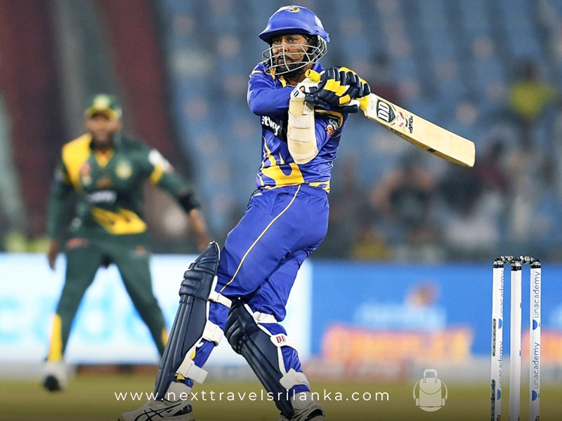 Tillakaratne Dilshan, the Amazing Sri Lankan Cricketer, batting in the field, wearing the Sri Lankan cricket costume.