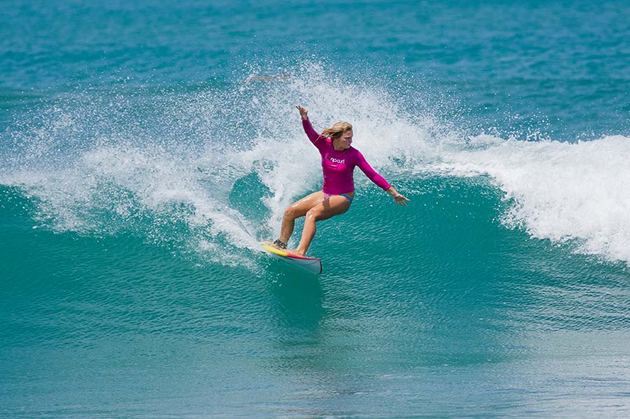 A foreign lady surfing, One of the Best Things to do at Arugam Bay