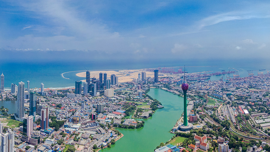 The lake, Lotus tower, ocean, and the buildings of Colombo, one of the most beautiful cities in Sri Lanka