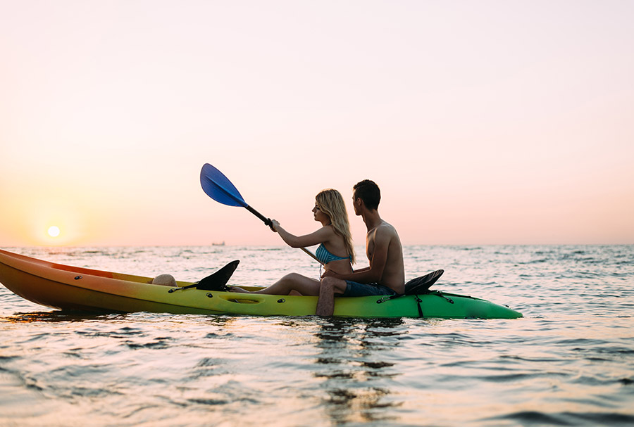 A Young Couple in swim wear Kayaking in Sri Lanka