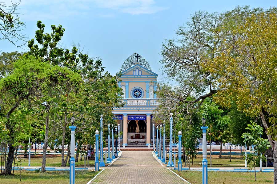 The path to the white buildings of the Shrine of Our Lady of Madhu