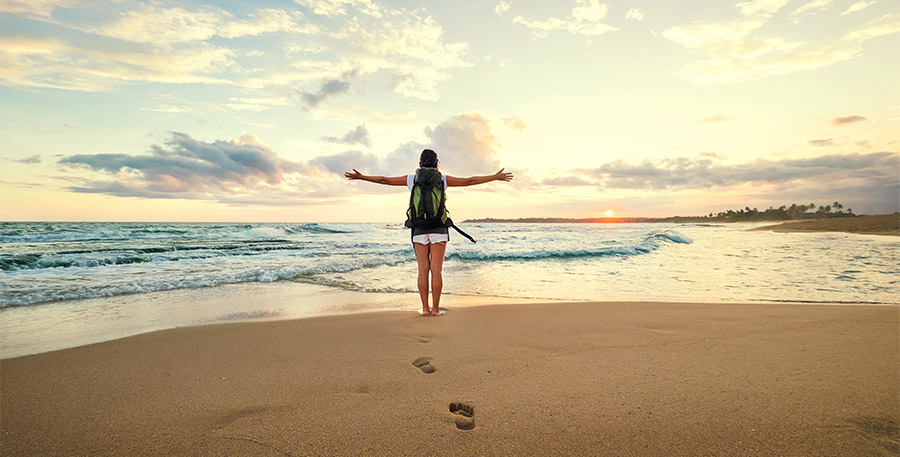 A foreign solo female traveler relaxing on a coast of Sri Lanka