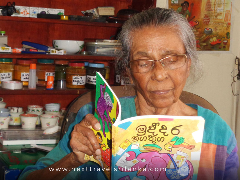 Sybil Wettasinghe, the Wonderful Writer and Artist reading a colorful book that she has written