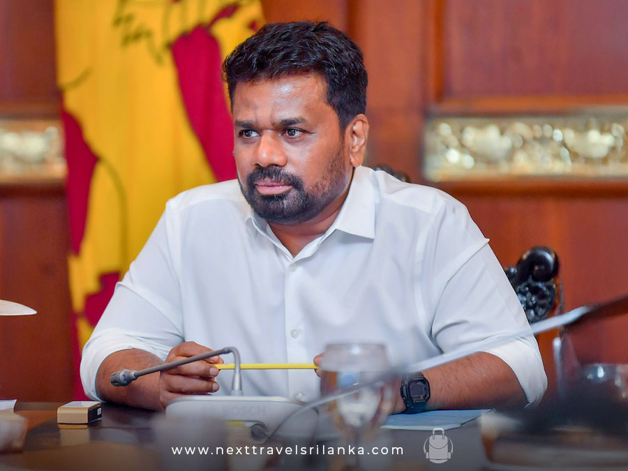Anura Kumara Dissanayake, the ninth executive president and the voice of a new political era in Sri Lanka, in a white shirt with a Sri Lankan flag in the background.