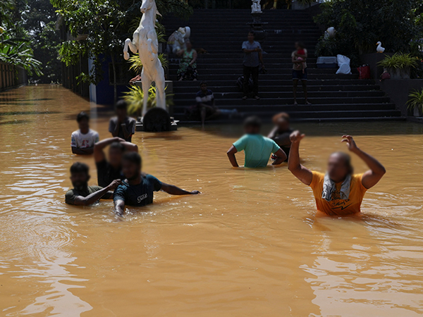 Urban streets submerged under floodwater, resembling canals during Cyclone Ditwah.